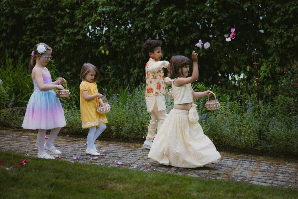 Flower girl / flower children at a whimsical backyard wedding