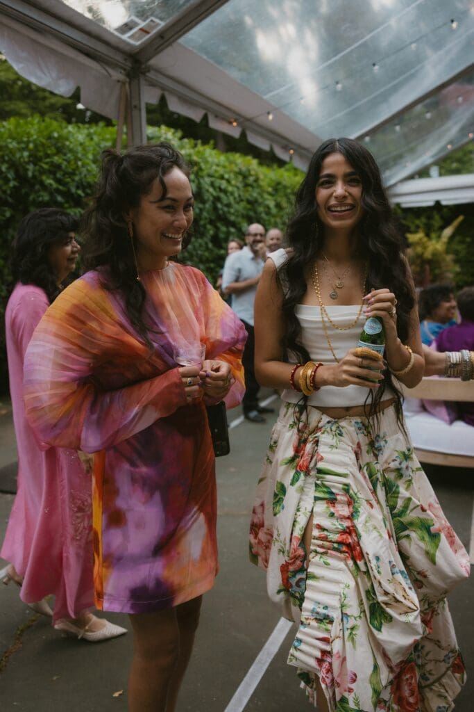 Bride laughing with a wedding guest
