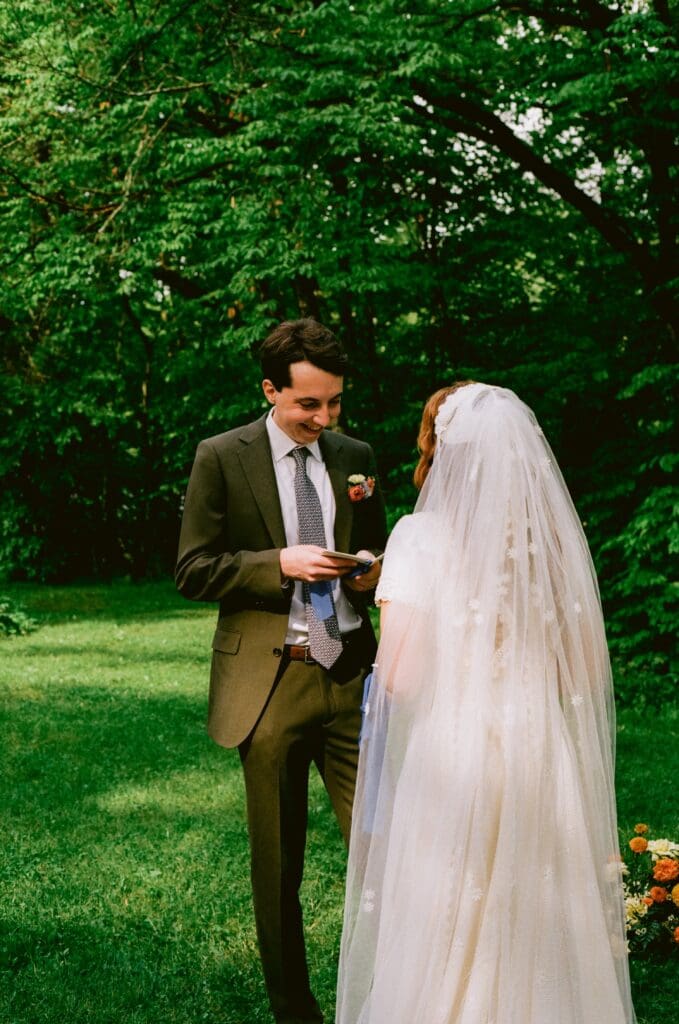 Groom reading his vows during the ceremony
