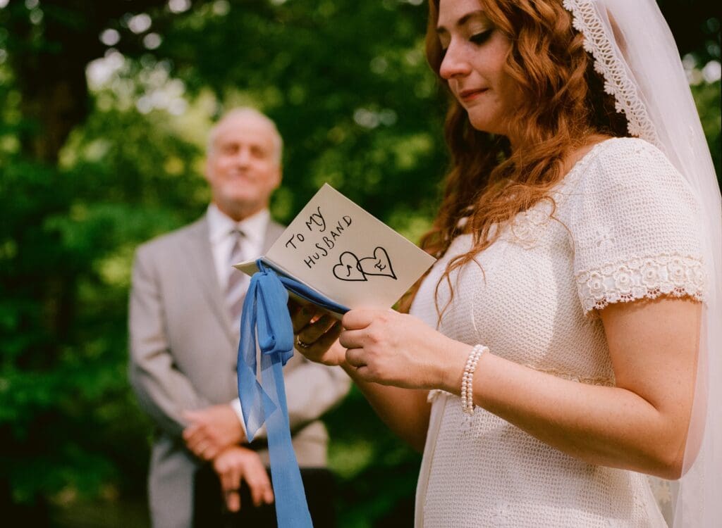 Bride reading her vows during the wedding ceremony