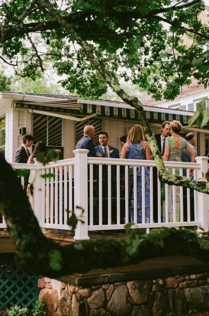 Wedding guests hanging out on the porch of Beaverkill Valley Inn