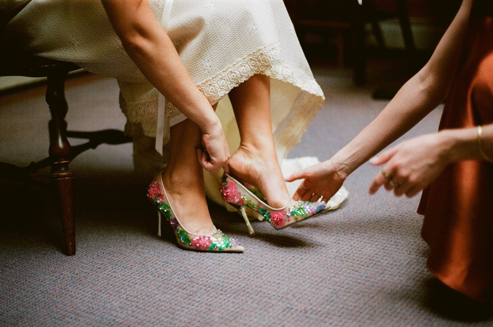 Close up of the bride putting on her heels
