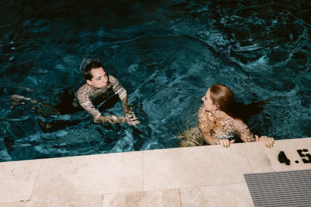 Bride and groom in a pool 