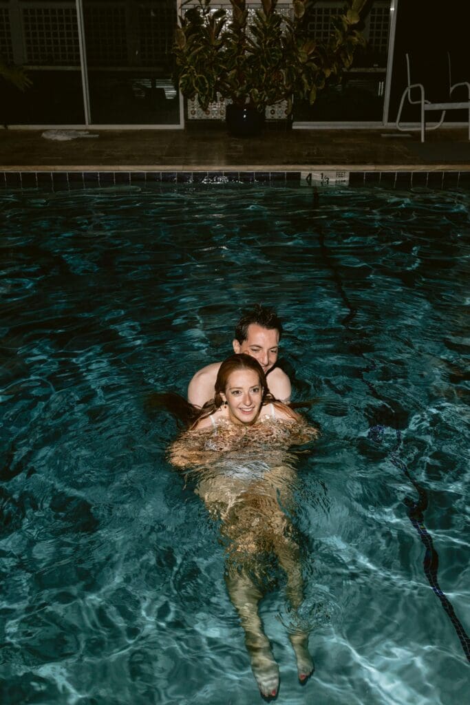 Bride and groom in a pool 