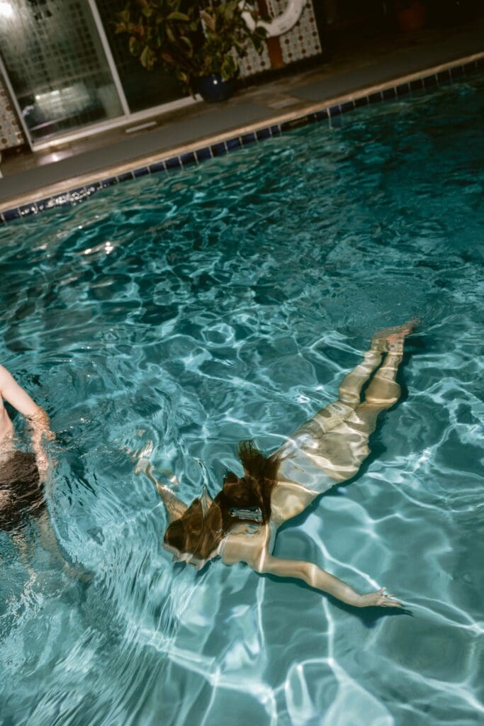 Bride and groom in a pool 