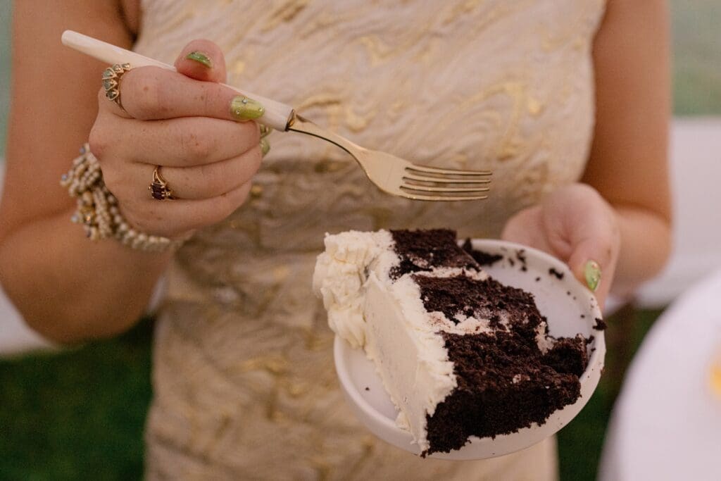 Bride holding a slice of cake
