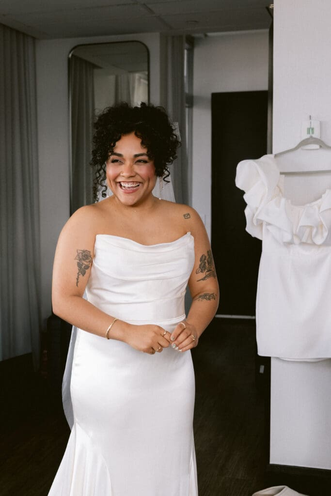 Bride laughing in her wedding dress
