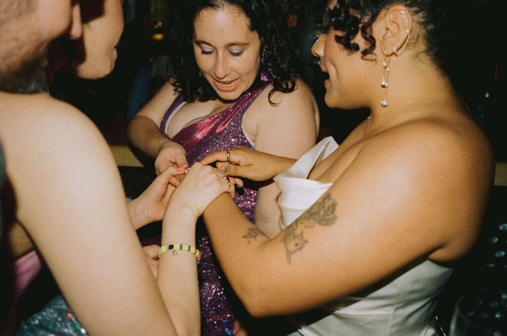 Wedding guests admiring the bride's ring