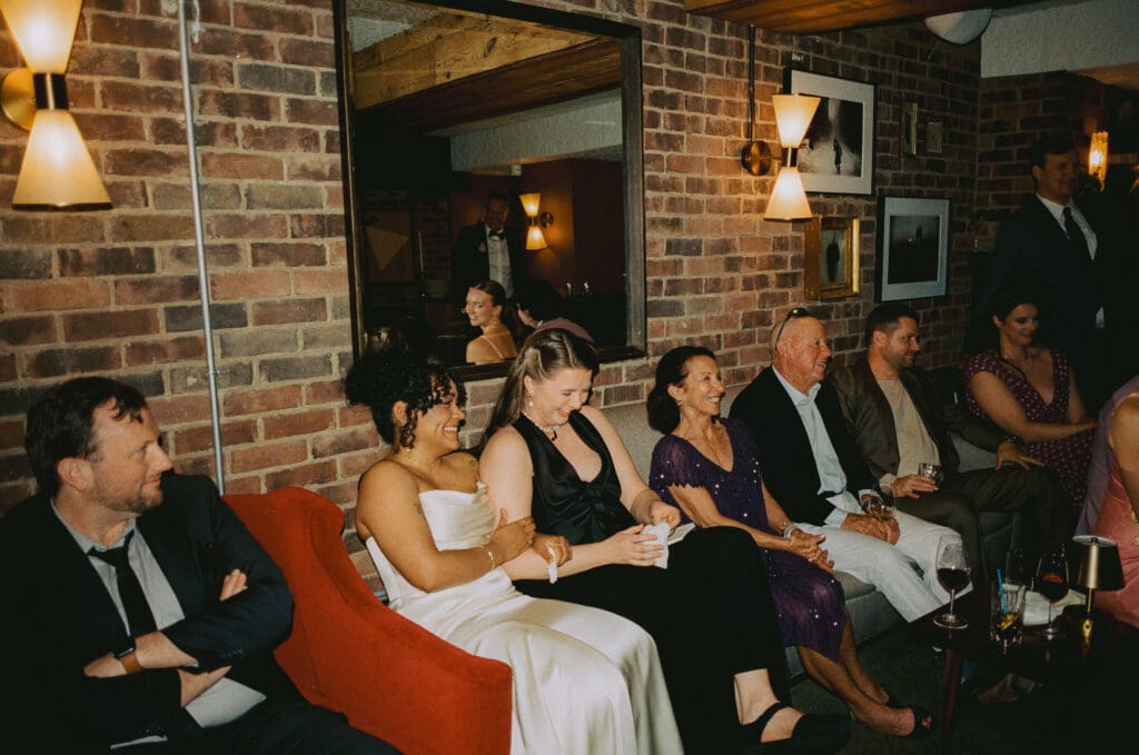 Brides laughing during a toast