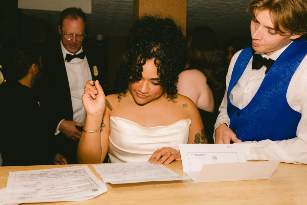 Bride signing the marriage license