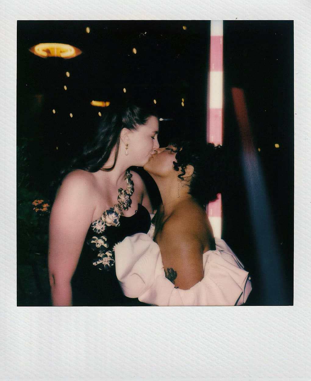 Polaroid of brides kissing