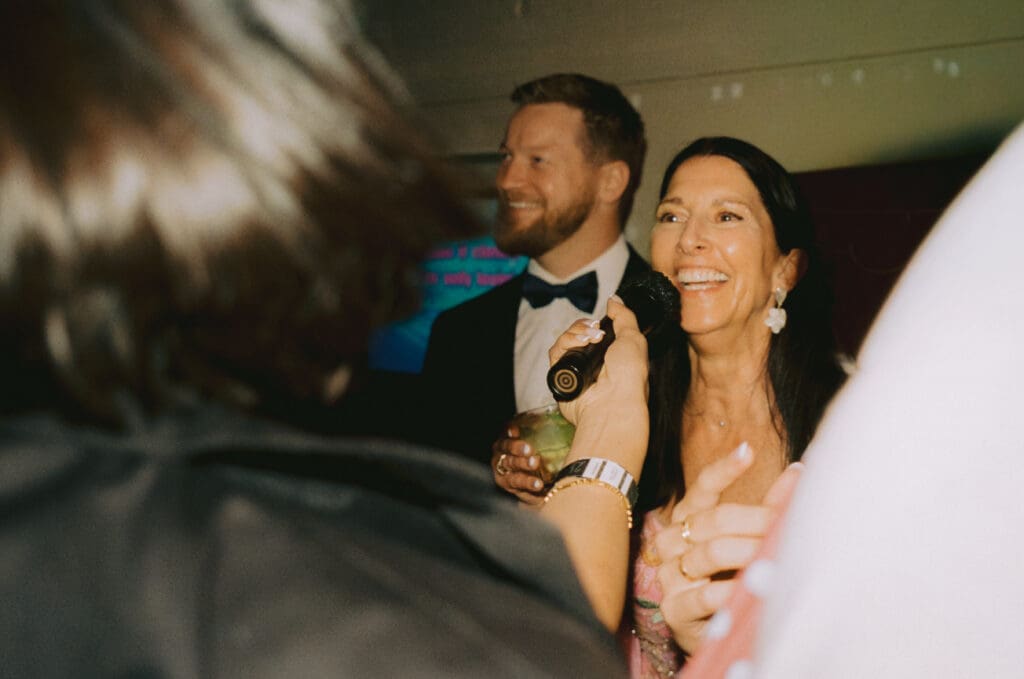 Mother of the bride singing karaoke at the afterparty