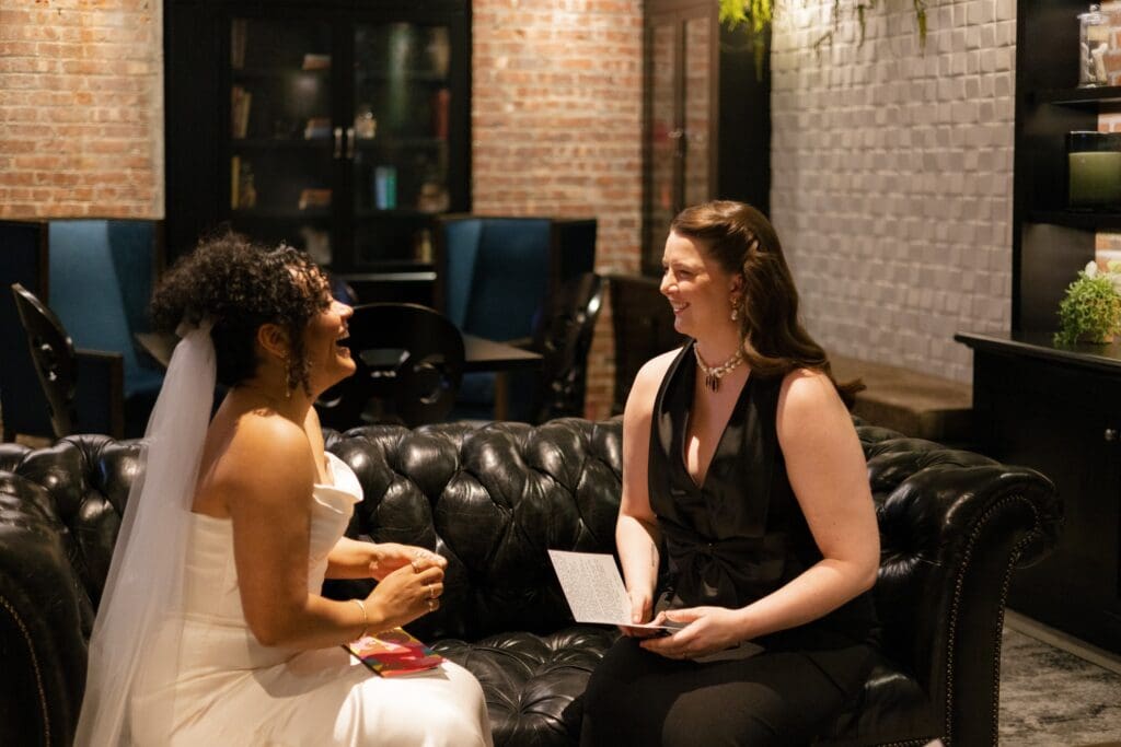 Brides smiling during their private vows