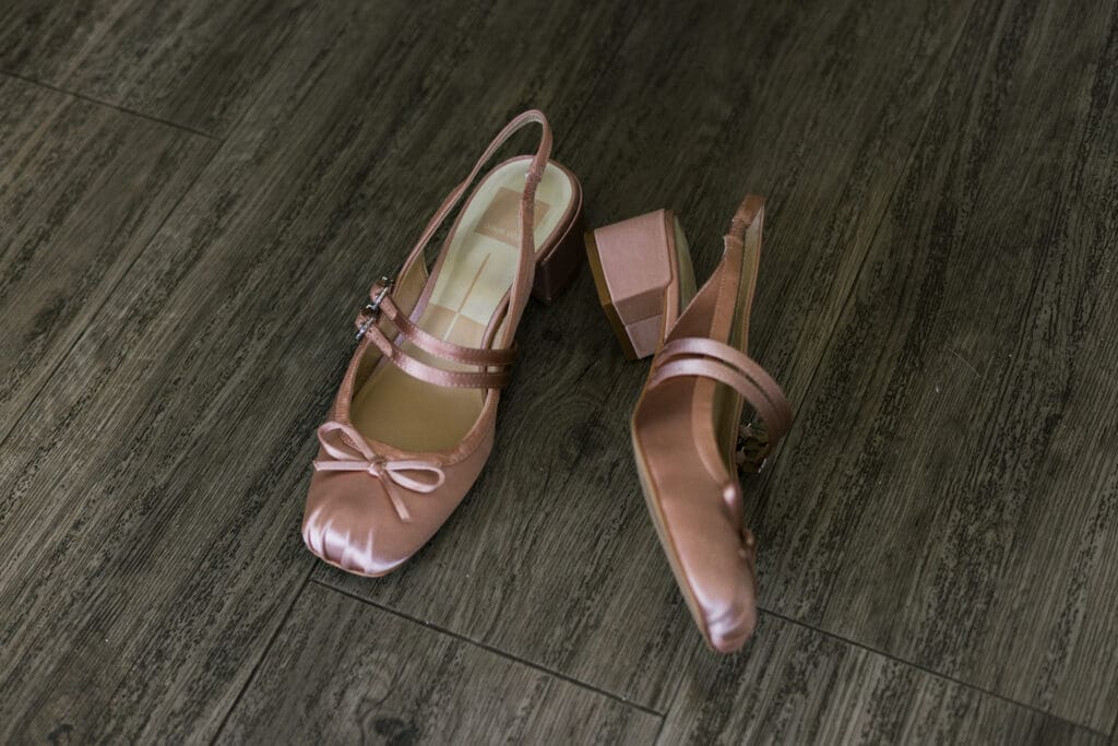 Bride's wedding heels laying on the floor