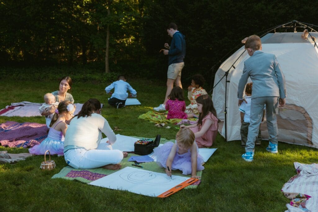 Children playing outside during a whimsical backyard wedding