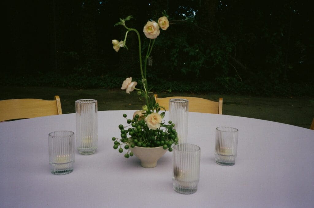 Close up of a reception table at a whimsical backyard wedding