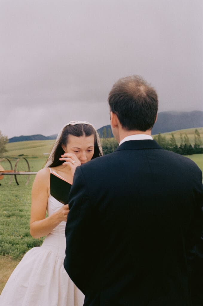 Bride reading her vows and crying