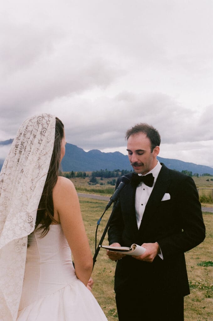 Groom reading his vows