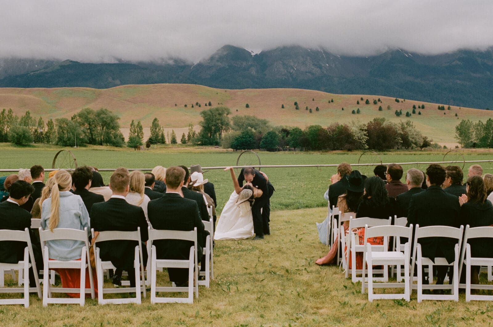 Bride and groom sharing their first kiss as a married couple