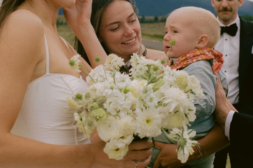 Bride with a baby in a cowboy outfit