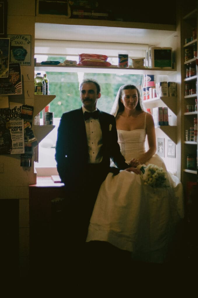 Bride and groom formal portrait in a general store