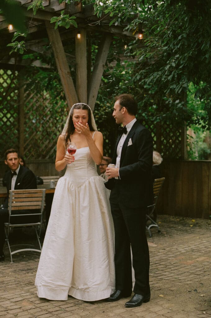 Bride and groom giving a welcome toast during the reception