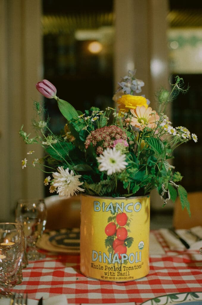 Flower centerpieces in tomato cans