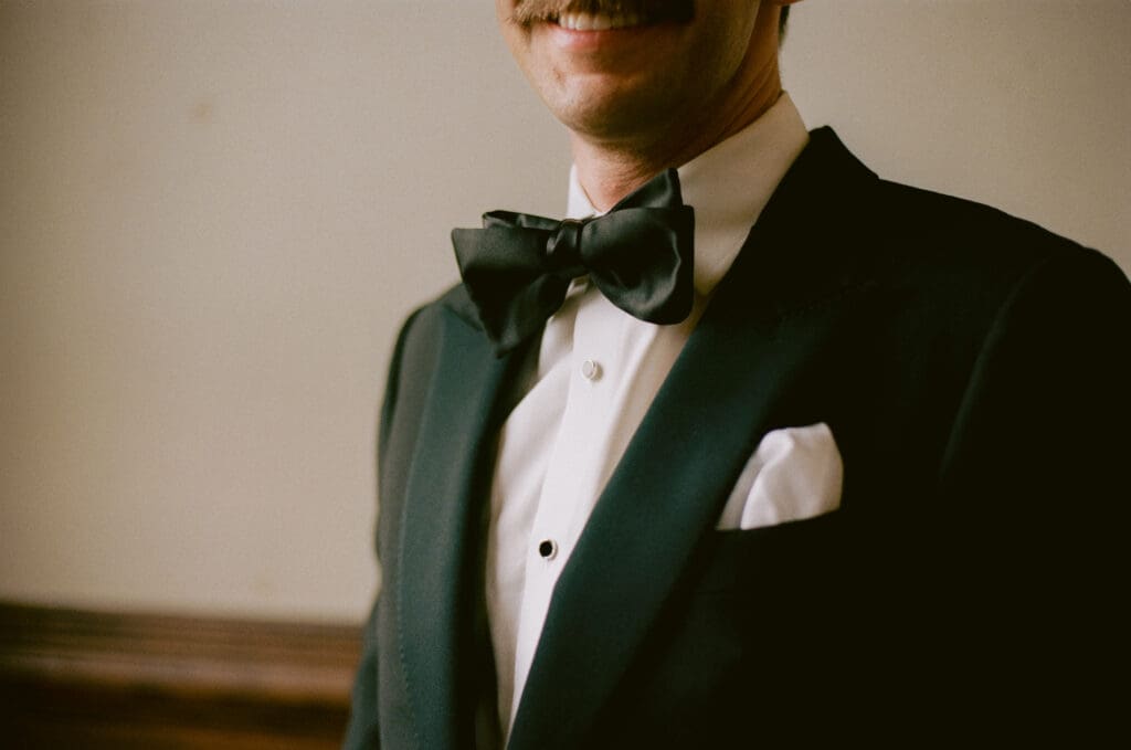 Close up of the groom's suit