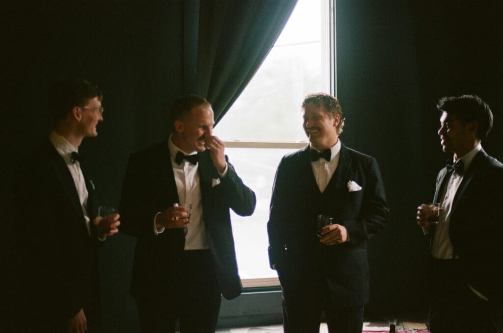 Candid photo of groomsmen during getting ready