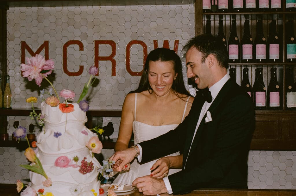 Bride and groom cutting the cake