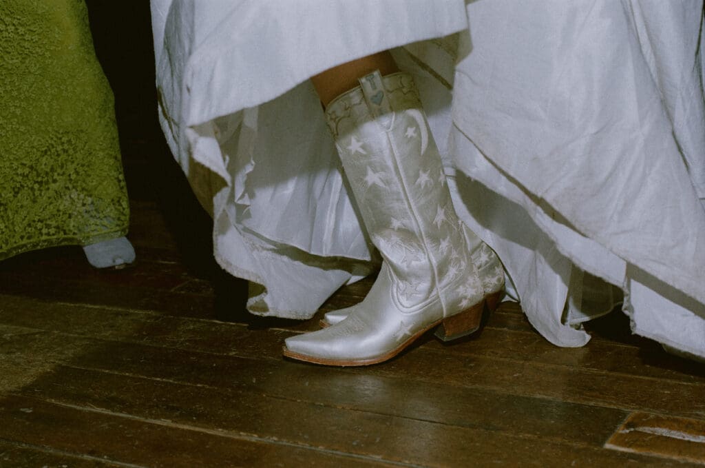 Close up of the bride's cowboy boots on the dance floor