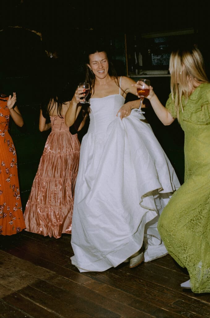 Bride dancing with guests on the dance floor