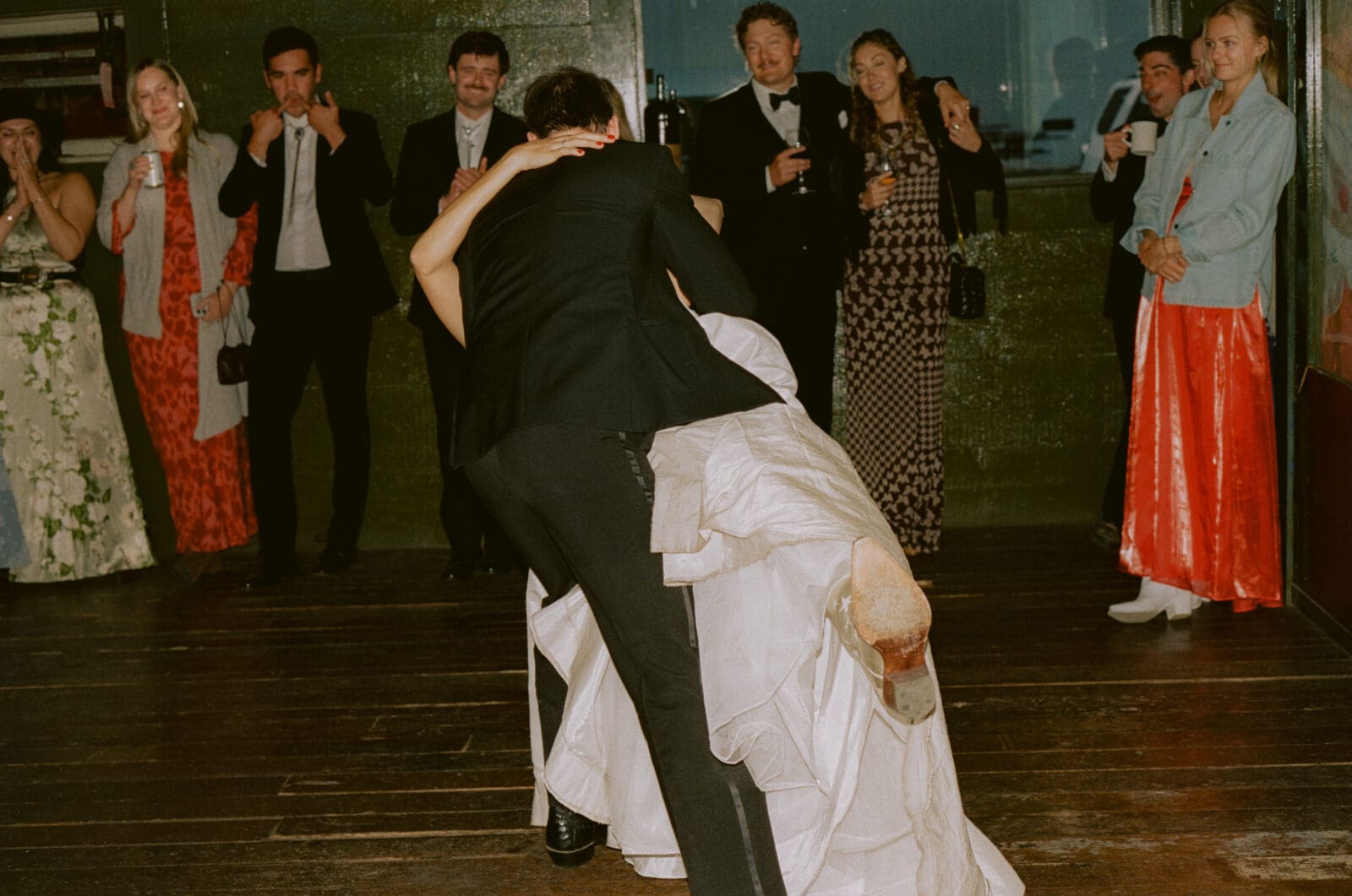 Groom dipping the bride during their first dance