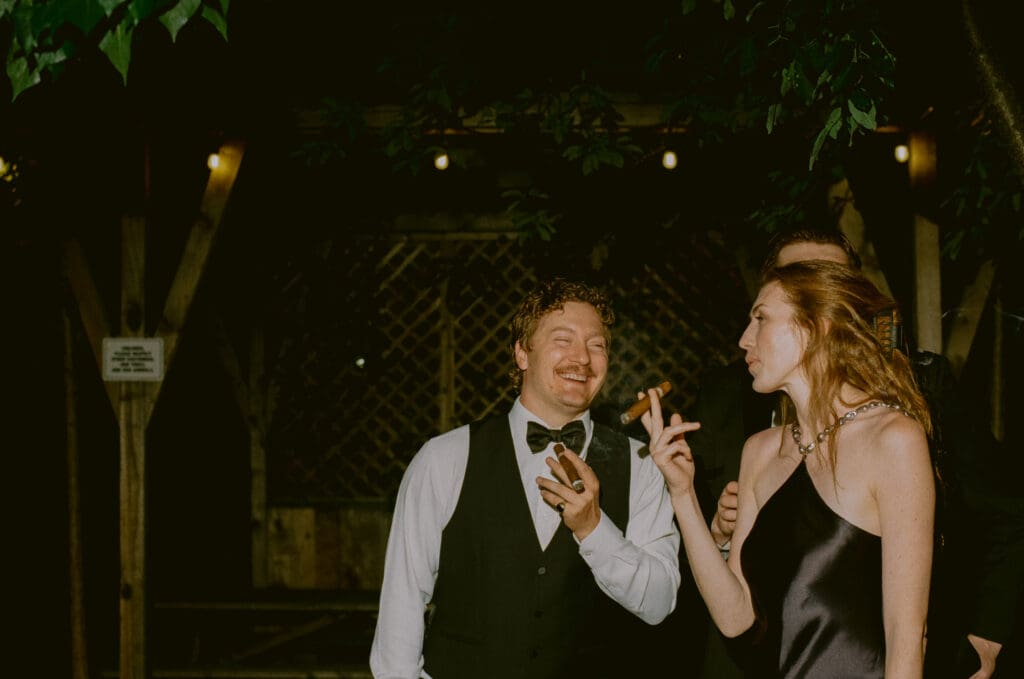 Wedding guests smoking cigars